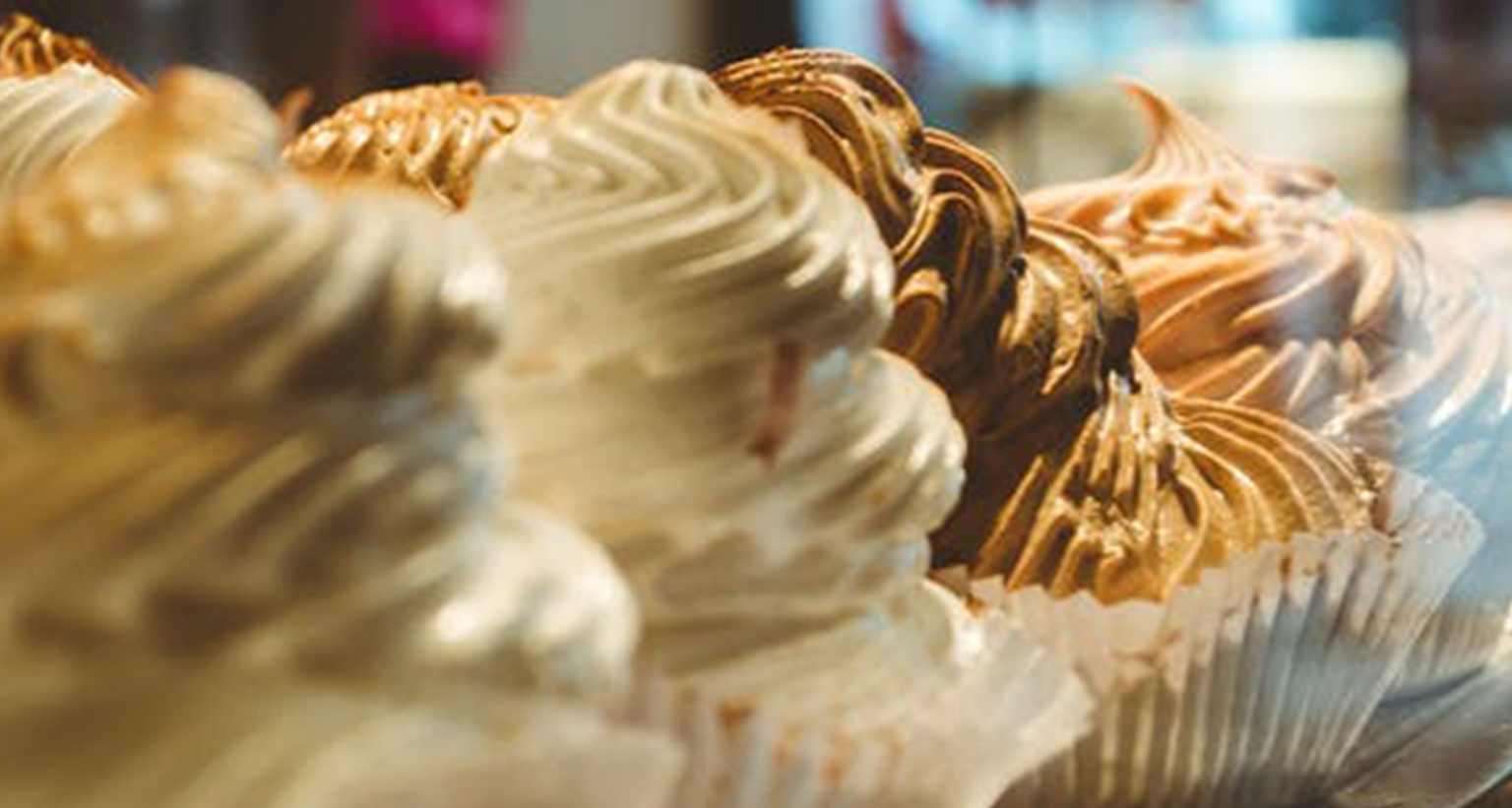 a line of cup cakes
