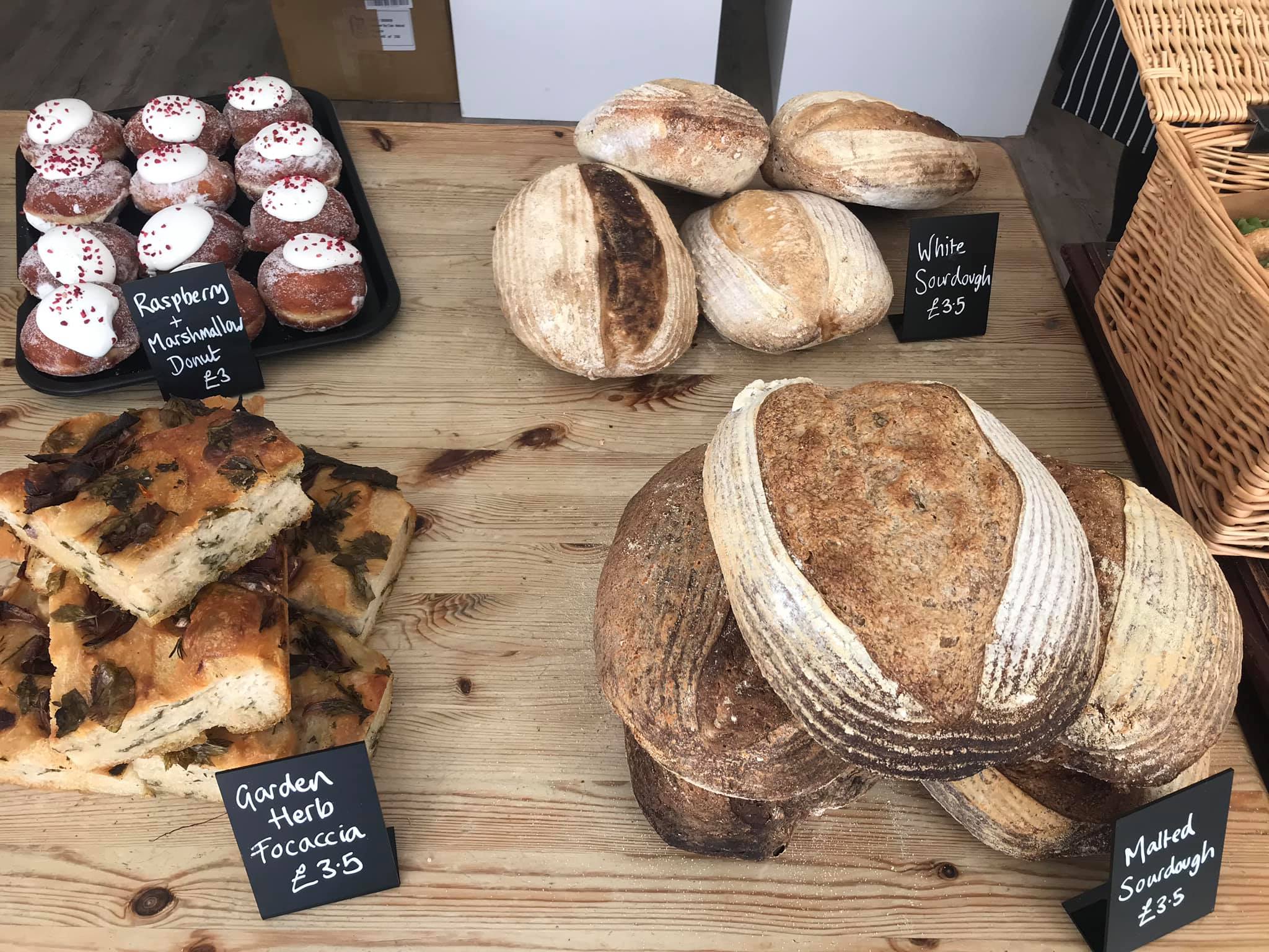 Freshly baked hand made brad and cakes on a wooden table