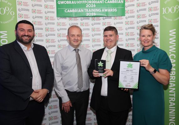Aaron Jones with his award received from Faith O’Brien, Cambrian Training Company’s managing director.