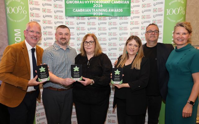 Anthony and Claire Christopher, owners of Penycae Inn, receive the Small Employer of the Year Award from Cambrian Training Company managing director Faith O’Brien.