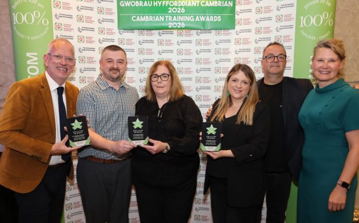 Anthony and Claire Christopher, owners of Penycae Inn, receive the Small Employer of the Year Award from Cambrian Training Company managing director Faith O’Brien.